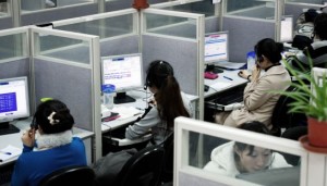 Employees work at a China-based company in the call centre of their headquarters in Shanghai. Andrew Ross/AFP Courtesy: PPP